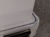 a plastic box with a lid that has a handle on it