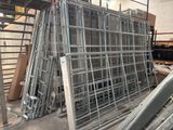 a large pile of metal frames in a warehouse