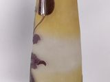 a vase that has a brown and yellow design on it