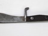 a knife that is laying on a white surface
