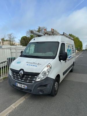 a white van that is parked on the side of the road