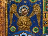 an image of a gold and blue tile with a picture of an angel