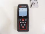 an image of a black and red device sitting on top of a white table