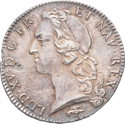 gros plan d'une pièce de monnaie sur laquelle figure une tête de femme