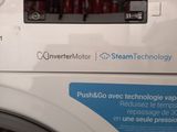 a washing machine that is sitting in a room