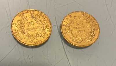 two gold coins, one of which is a sovereign and the other of which is a sovereign