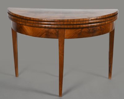 an oval shaped table with a marble top and wooden legs