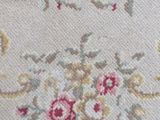 an image of a close up of a rug with flowers on it