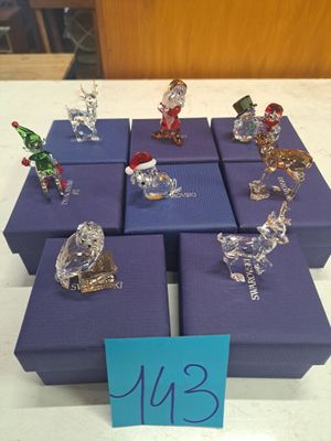 many glass figurines on display on a table