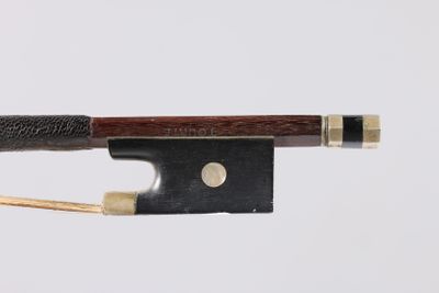 a close up of a violin bow on a white background