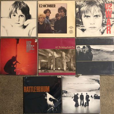 a lot of cd ' s that are on the floor