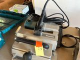 a machine that is sitting on a table with a lot of tools