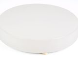 a white round box with a gold handle on a white background