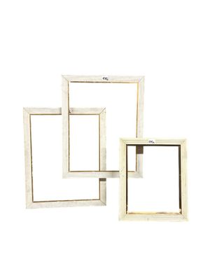 three white wooden square shelves with one open and the other closed