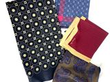 several different types of ties are laid out on a white surface