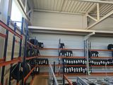 a large room with lots of racks and shelves filled with luggage