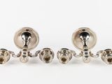 a pair of silver plated candlesticks and a pair of silver plated candlesticks and a pair of silver plated candlesticks