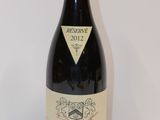 a bottle of wine that is sitting on a table
