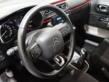 a car dashboard with a steering wheel and a dash board