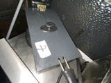 a large fryer sitting on top of a metal counter