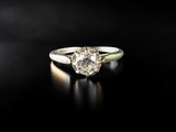 an engagement ring with a diamond in the center