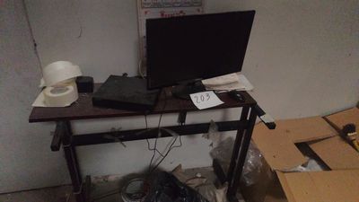 a desk with a monitor and a laptop on it