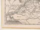 a picture of a map hanging on a wall