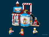two legos that are standing in front of a building