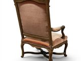 an image of a chair with a beige upholstered seat