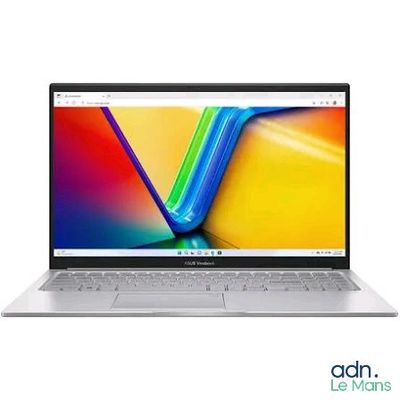l'ordinateur portable est ouvert sur une surface blanche avec un arrière-plan coloré