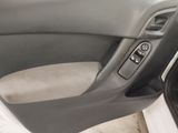 the interior of a car with the door open showing the control buttons