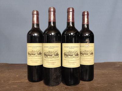three bottles of wine sitting on top of a wooden table
