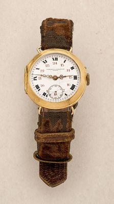 a close up of a wrist watch with roman numerals on it
