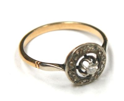 a gold ring with a diamond in the center