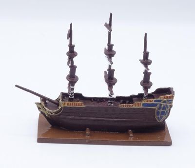 a small model of a pirate ship on a stand