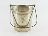 an antique silver plated ice bucket with handles on a white background