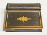 a black box with a gold design on it