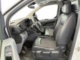 the interior of a car with the driver ' s seat folded down