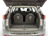 two seats in the back of a car with the trunk open