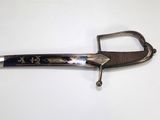 an image of a sword with a metal handle on a white surface