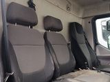 four seats in the back of a van that are empty