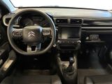the interior of a car with a steering wheel and dashboard controls