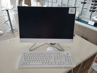 a computer on a desk with a keyboard and mouse