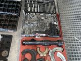 a lot of tools that are laying out on the floor