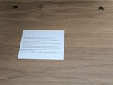a box with a piece of paper on top of it