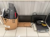 a lot of electronics that are sitting on the floor