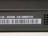 a close up of the back of a laptop with a barcode on it