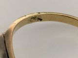 an image of a close up of a ring with a diamond on it