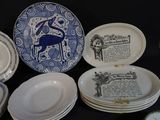 a lot of plates that are sitting on a table