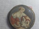 a picture of a woman holding a cat in her lapel